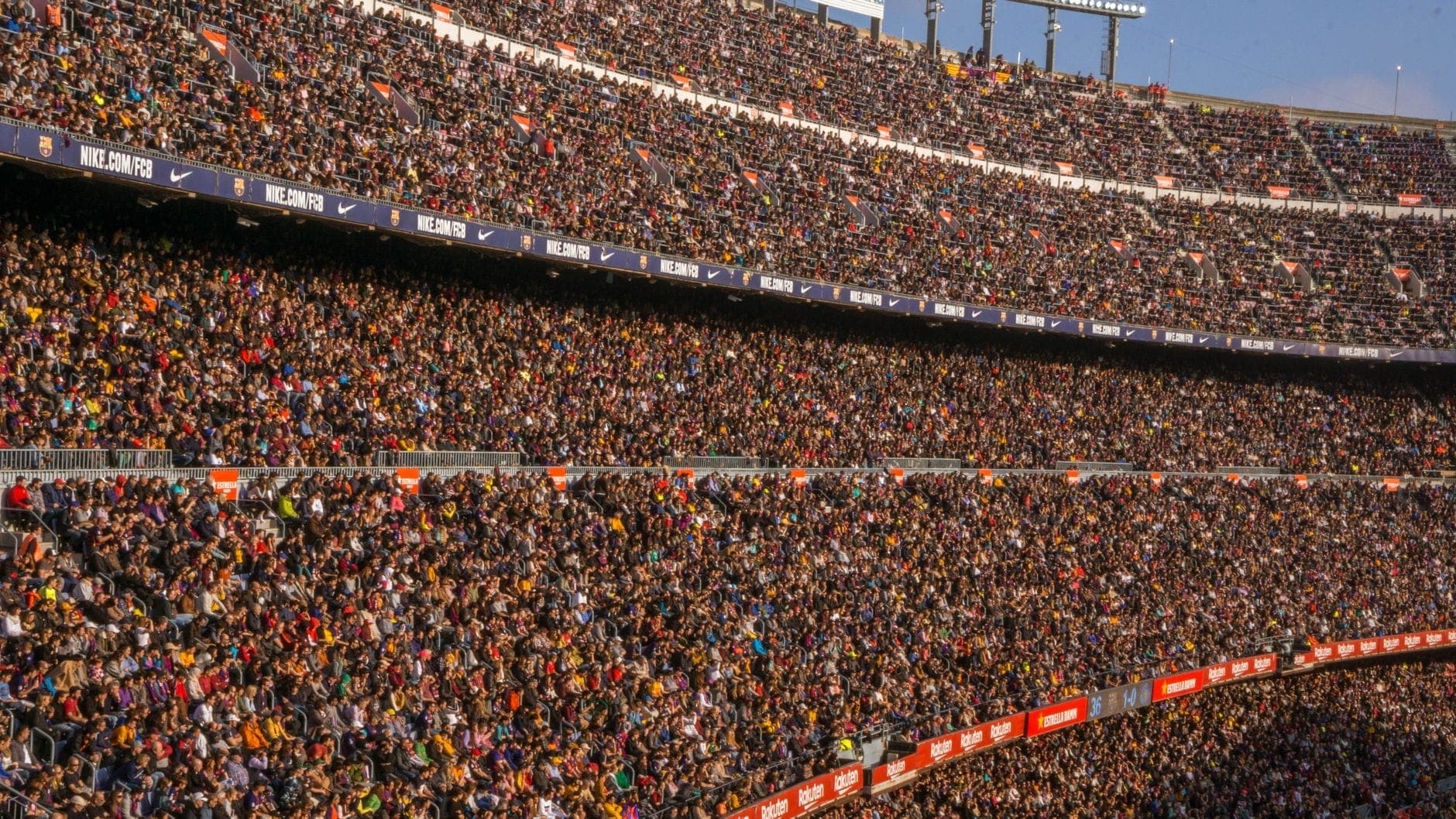 A packed stadium crowd during a match, the Optus Stadium and HBF Park events Maxi Cab Perth runs group transport for