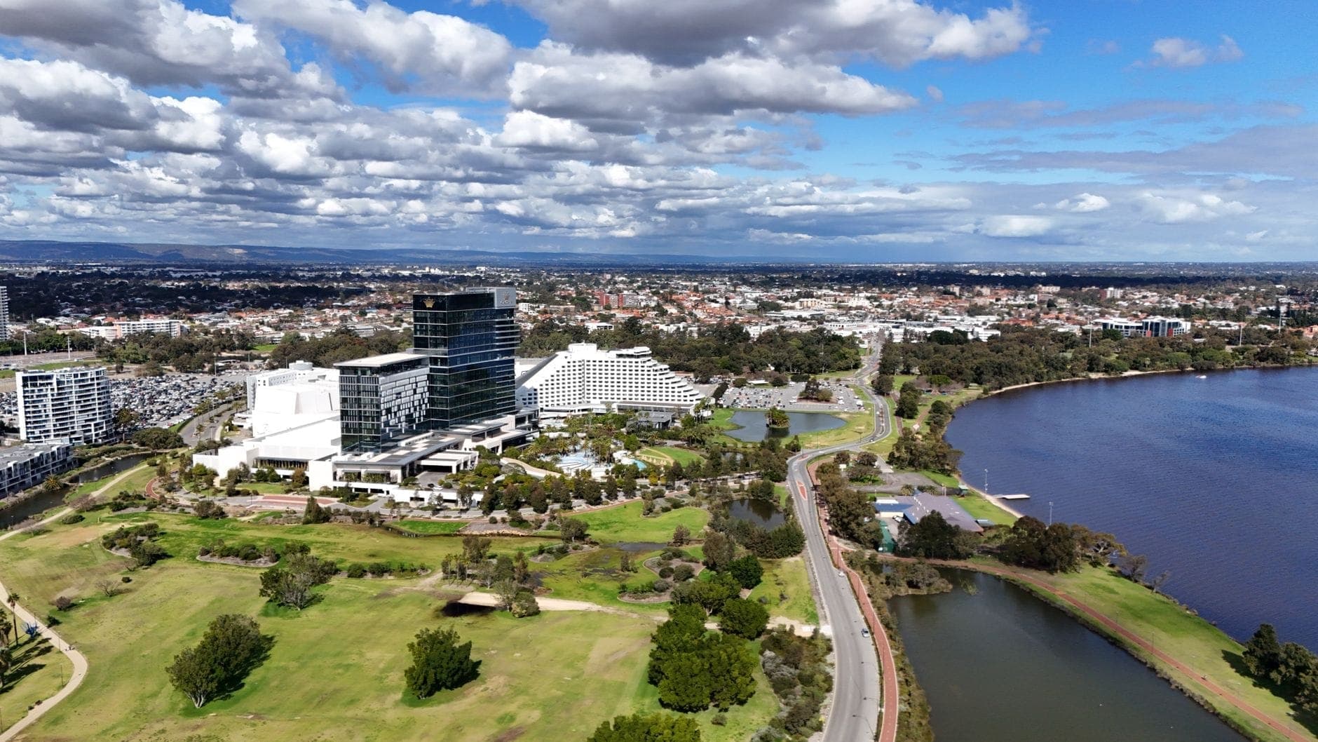 Aerial view of Burswood and the Swan River in Western Australia, home to Crown Perth and Optus Stadium maxi cab pickups. Maxi Cab Perth runs fixed-fare maxi taxi pickups in Burswood.