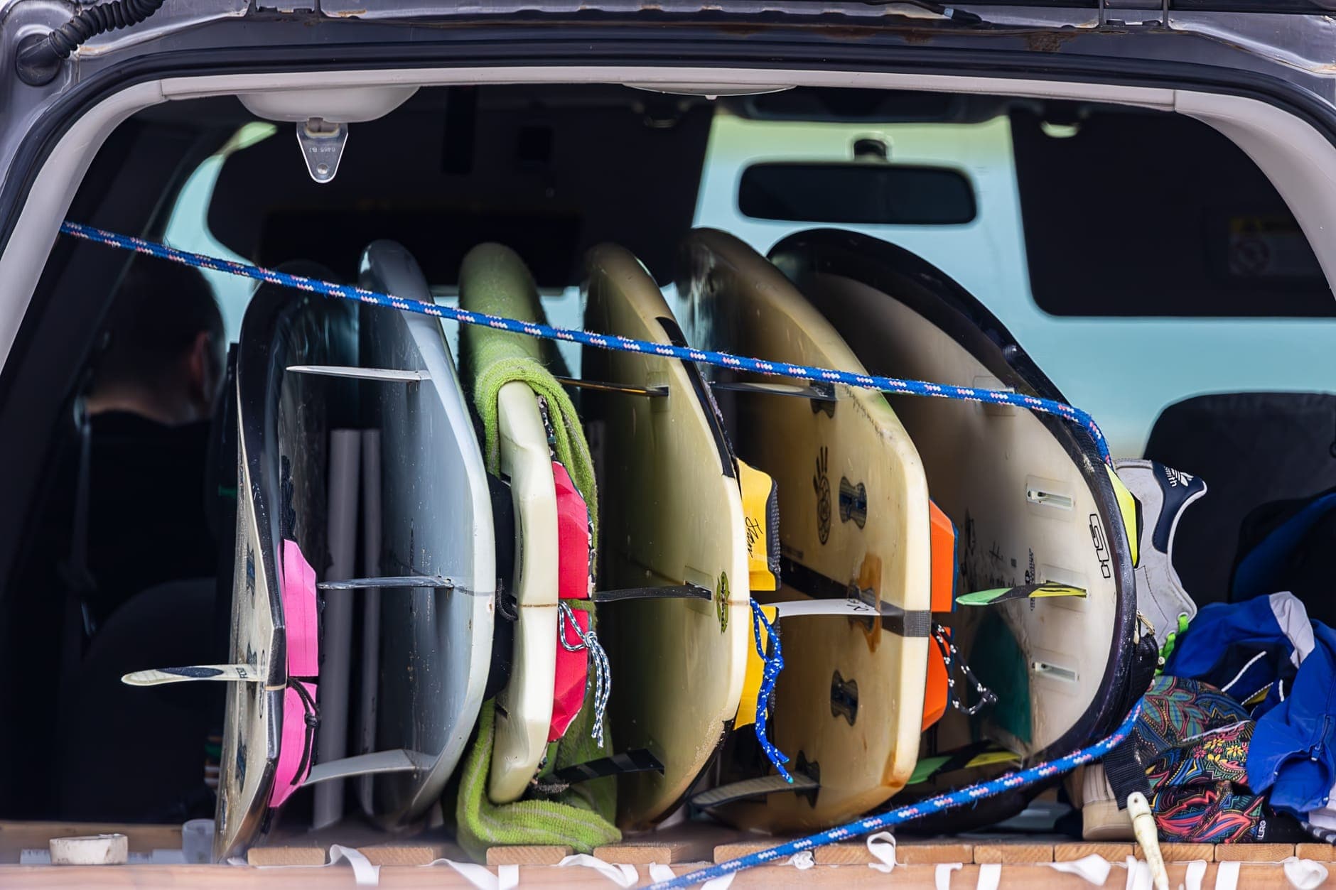 Surfboards stacked in the back of a vehicle, the oversize load a Perth maxi cab carries to Scarborough and Trigg beaches